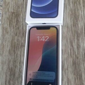 Used Apple iPhone 12 with screen protector and charging cable